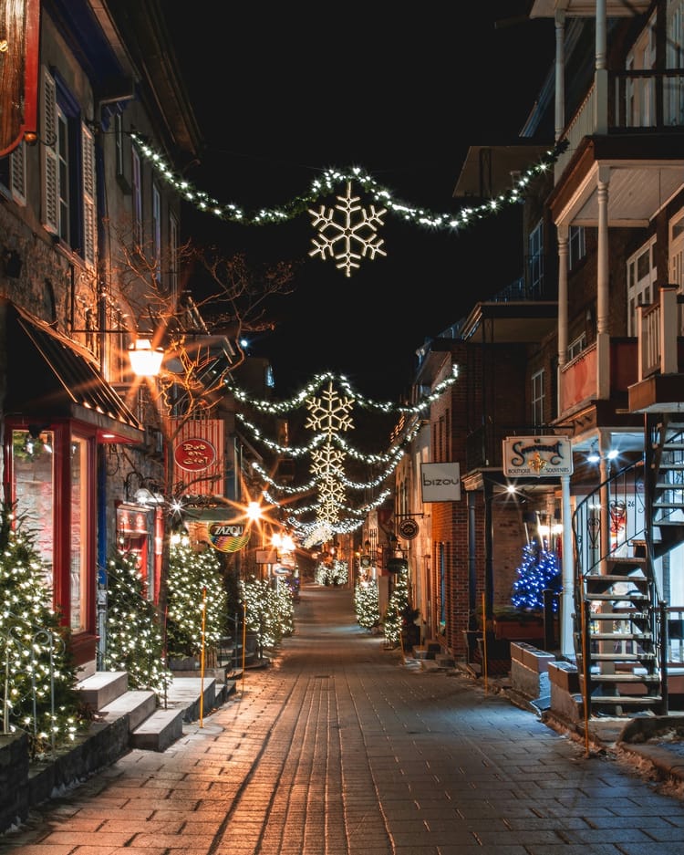 Holiday Street Lights (From https://unsplash.com/photos/a-city-street-is-decorated-with-christmas-lights-W1fjsX7vdXs)
