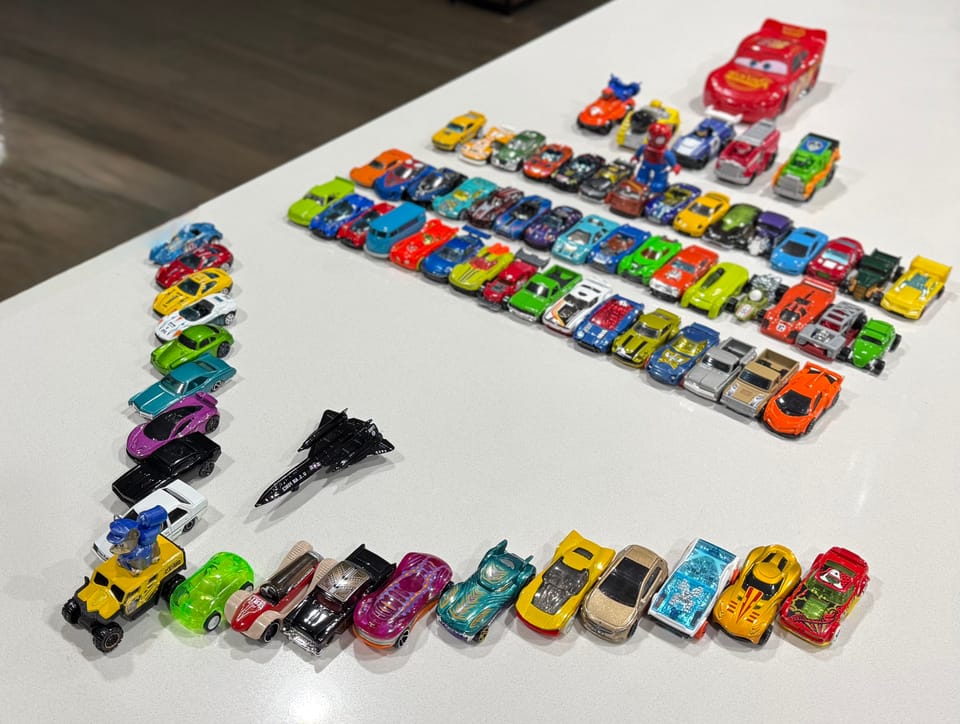 My daughter's subset of toy cars. Picture credit - me! A set of toy cars arranged like an aircraft. Also shown is Blackbird toy model - fastest aircraft I know of!